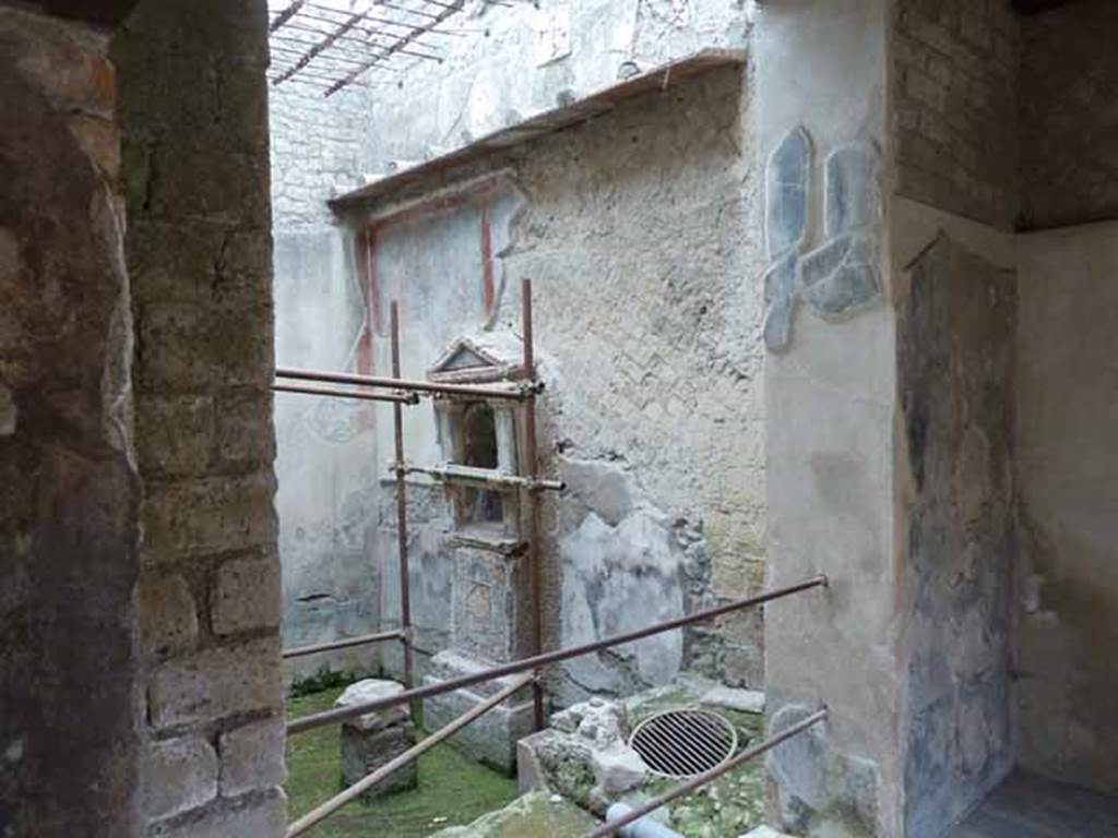 III.3 Herculaneum. May 2010. Looking east from small room towards the small internal courtyard or light-well. This area was protected by a grating above.